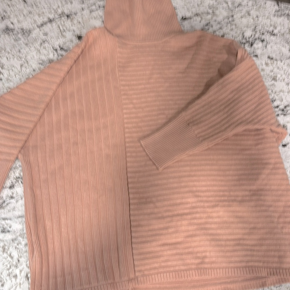 NWOT, women’s xl sweater, color is a soft pale pink , very soft material,